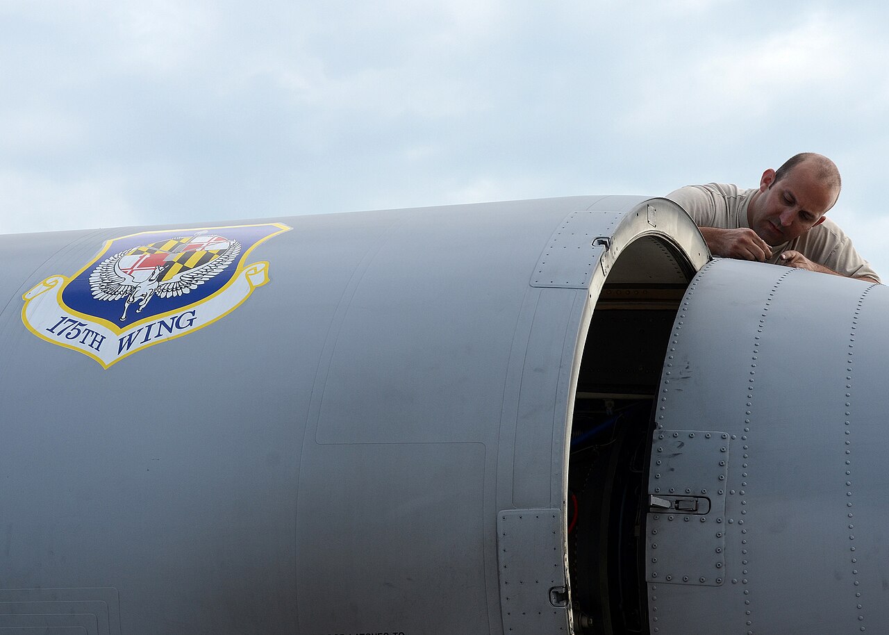 Air Force mechanic repairing an A-10 aircraft engine